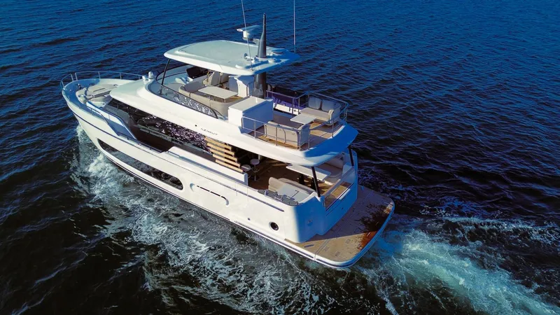 Slide: The Image of 2025 Azimut Magellano 60 yacht cruising on open water, showcasing luxury design. - 2