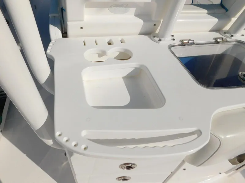 Slide: The Image of 2016 Everglades 355 Center Console boat, featuring a white utility station with cup holders. - 30