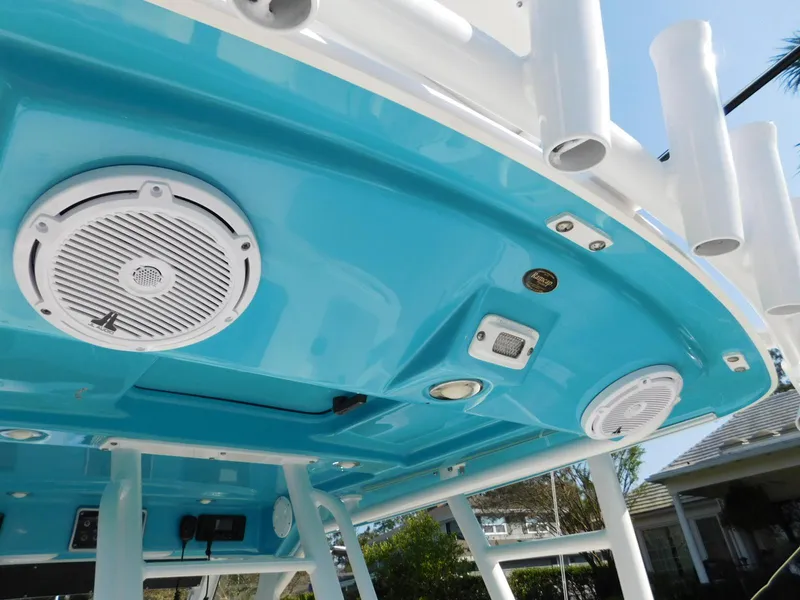 Slide: The Image of 2016 Everglades 355 Center Console boat with blue ceiling and speakers. - 31
