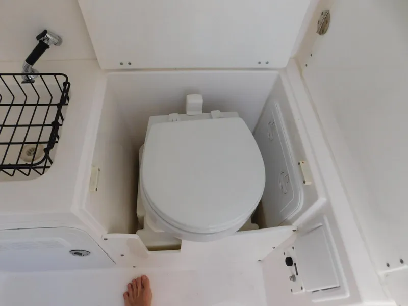 Slide: The Image of Compact marine toilet in 2016 Everglades 355 Center Console boat. - 35