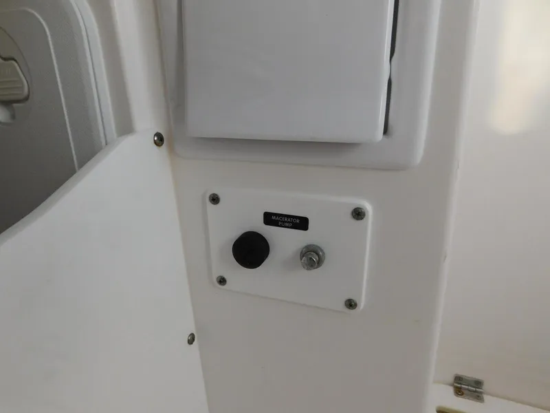 Slide: The Image of Control panel on a 2016 Everglades 355 Center Console boat interior. - 38