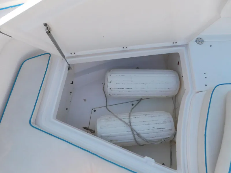 Slide: The Image of Storage compartment on 2016 Everglades 355 Center Console with two white fenders. - 45