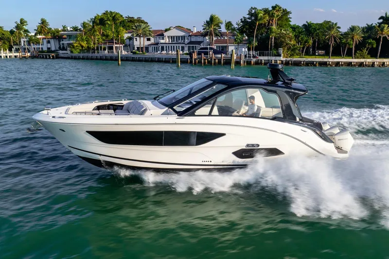 Slide: The Image of 2023 Sea Ray Sundancer 370 OB cruising on a scenic waterway. - 1