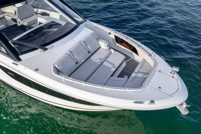 Slide: The Image of 2023 Sea Ray Sundancer 370 OB cruising on clear blue water. - 10