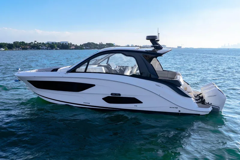 Slide: The Image of 2023 Sea Ray Sundancer 370 OB cruising on open water. - 12