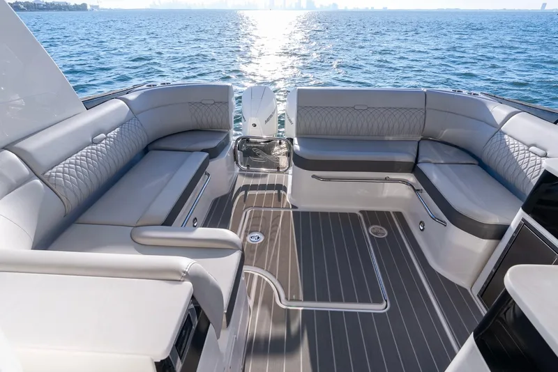 Slide: The Image of Luxurious 2023 Sea Ray Sundancer 370 OB boat interior with elegant seating and ocean view. - 16