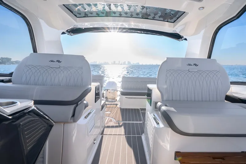 Slide: The Image of 2023 Sea Ray Sundancer 370 OB interior with ocean view and luxurious seating. - 18