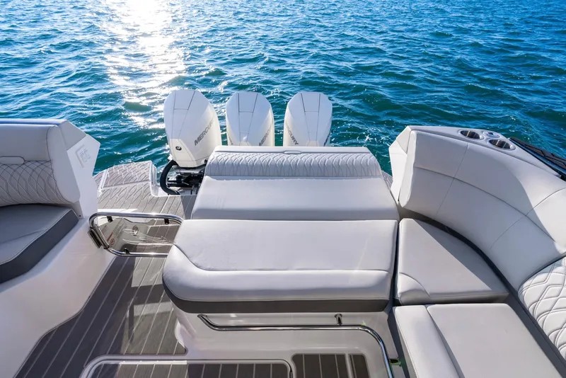 Slide: The Image of 2023 Sea Ray Sundancer 370 OB boat with luxurious seating and triple outboard engines. - 19