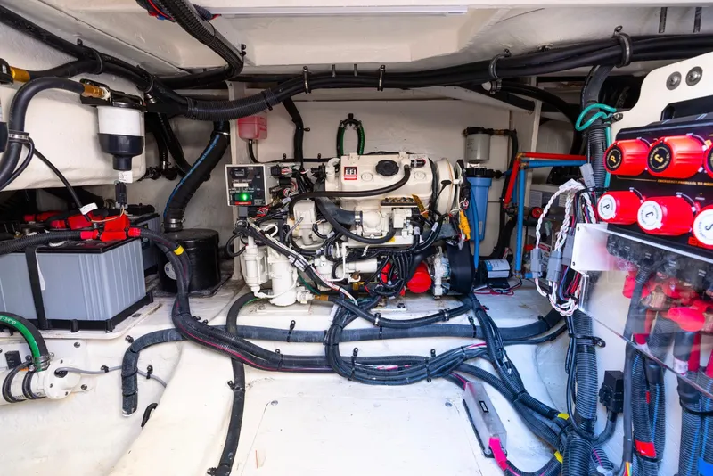Slide: The Image of Engine room of 2023 Sea Ray Sundancer 370 OB with visible wiring and components. - 25