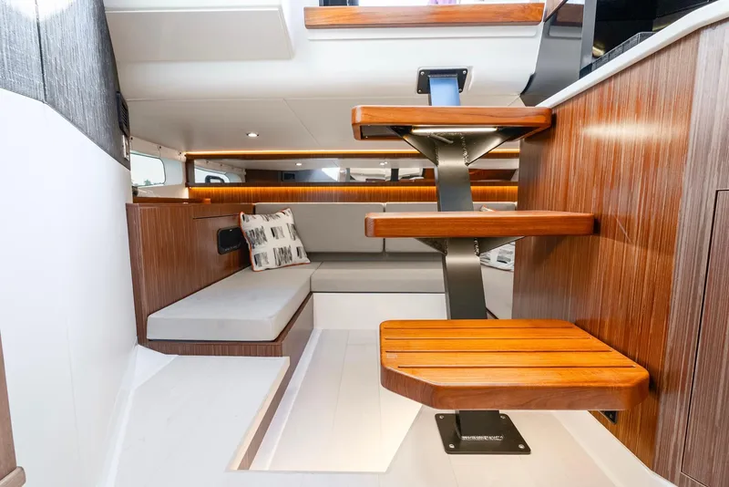 Slide: The Image of Interior of 2023 Sea Ray Sundancer 370 OB, featuring modern wood finishes and sleek design. - 31