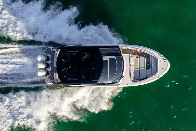 Slide: The Image of Aerial view of 2023 Sea Ray Sundancer 370 OB cruising on water. - 4
