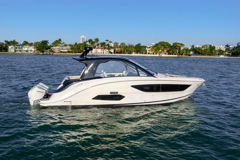 Slide: The Image of 2023 Sea Ray Sundancer 370 OB cruising on a sunny day. - 7