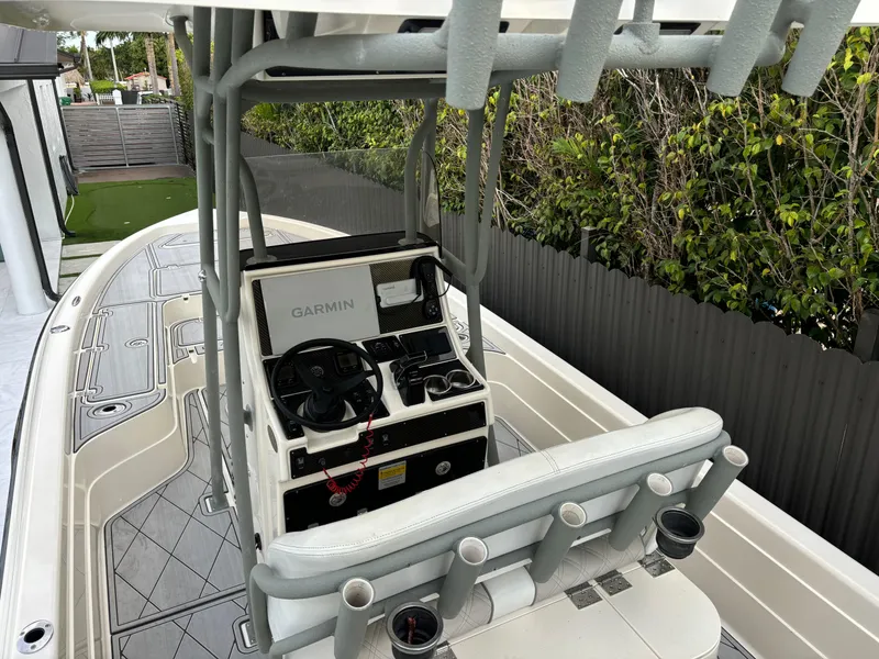 Slide: The Image of 2014 ShearWater 25LTZ boat with Garmin navigation system and rod holders. - 10