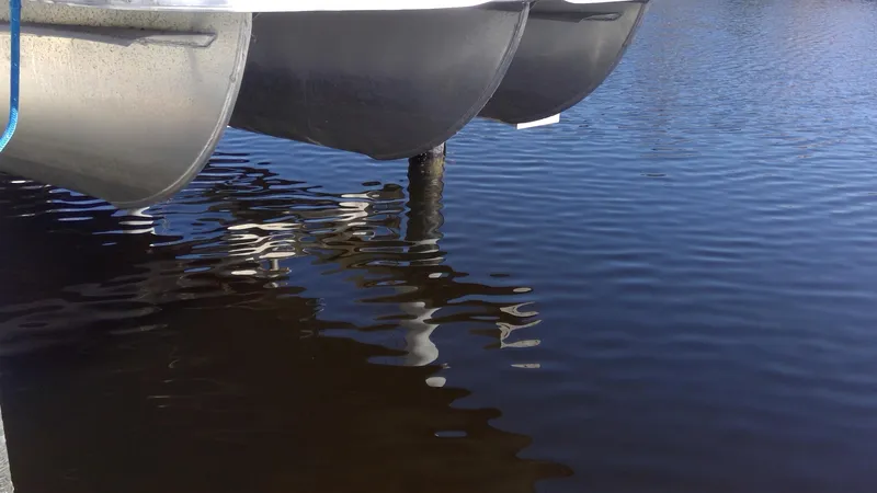 Slide: The Image of 2020 Landau Atlantis 250 Cruise pontoon boat on calm water. - 11