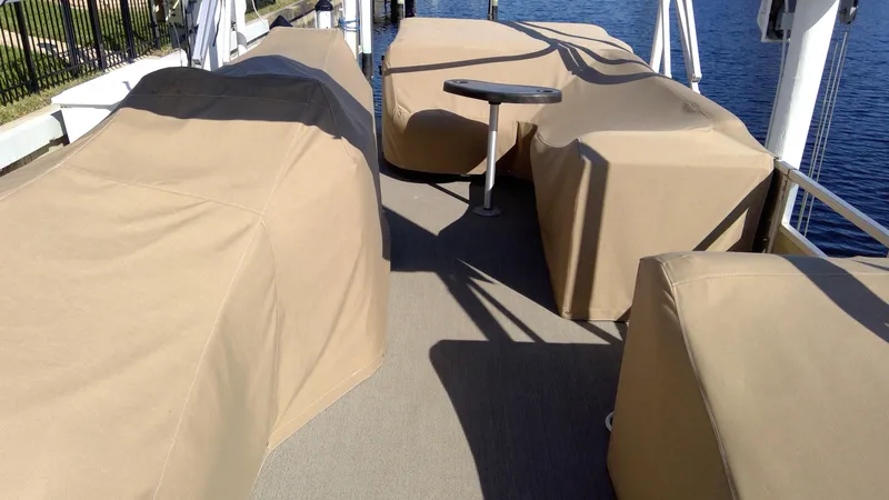 Slide: The Image of 2020 Landau Atlantis 250 Cruise boat with covered seating and table on deck. - 15