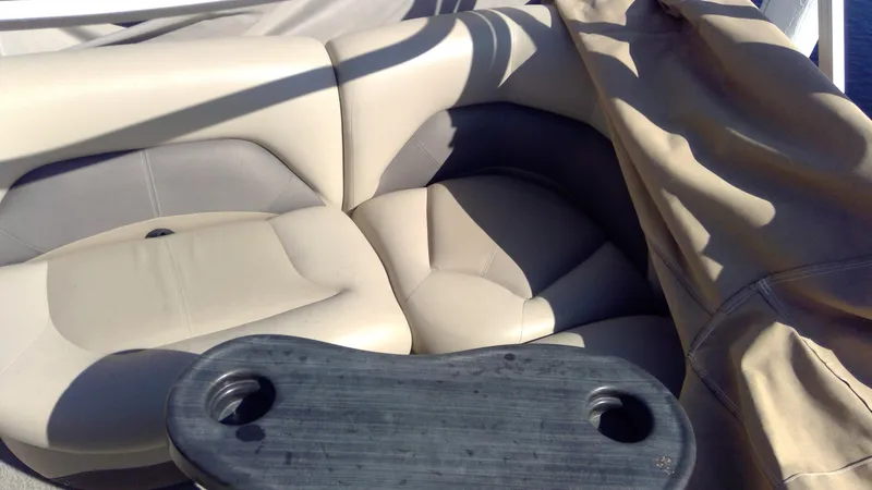 Slide: The Image of 2020 Landau Atlantis 250 Cruise boat seating with cup holders and protective cover. - 26