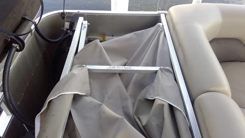 Slide: The Image of 2020 Landau Atlantis 250 Cruise boat storage compartment with cover and seating. - 29