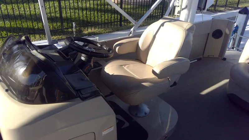 Slide: The Image of 2020 Landau Atlantis 250 Cruise boat interior with captain's chair and steering console. - 31