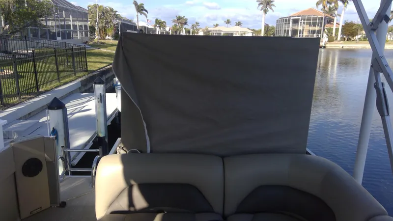 Slide: The Image of 2020 Landau Atlantis 250 Cruise boat docked by a canal with palm trees. - 41