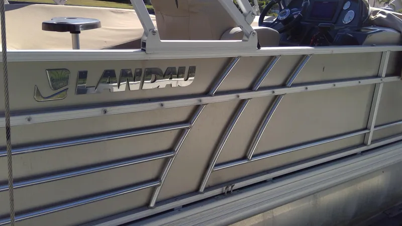 Slide: The Image of 2020 Landau Atlantis 250 Cruise pontoon boat side view with logo. - 8