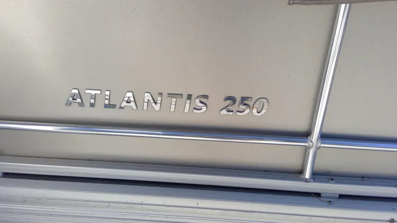 Slide: The Image of 2020 Landau Atlantis 250 Cruise boat nameplate with metallic lettering. - 9