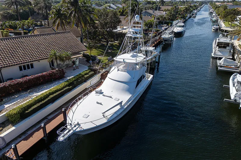 Slide: The Image of Viking 68 Convertible yacht, 2007 model, docked in a scenic canal. - 11