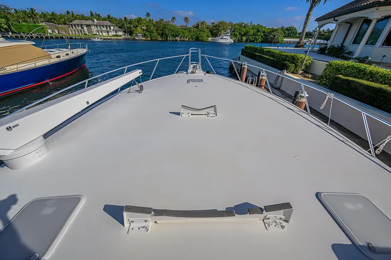 Slide: The Image of 2007 Viking 68 Convertible yacht deck with scenic waterfront view. - 17