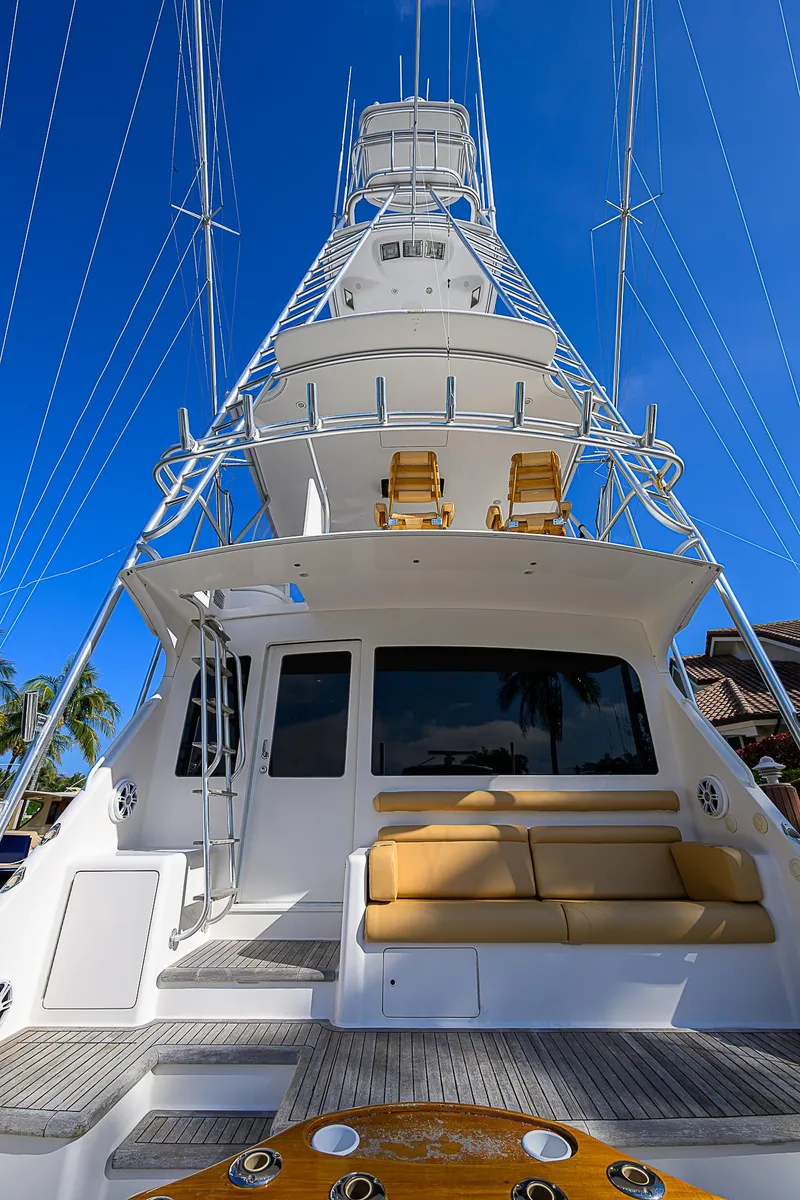 Slide: The Image of 2007 Viking 68 Convertible yacht with tower against clear blue sky. - 26