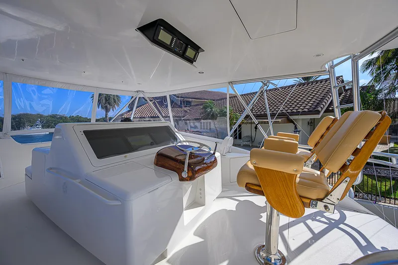 Slide: The Image of Interior of 2007 Viking 68 Convertible yacht with helm and seating. - 3
