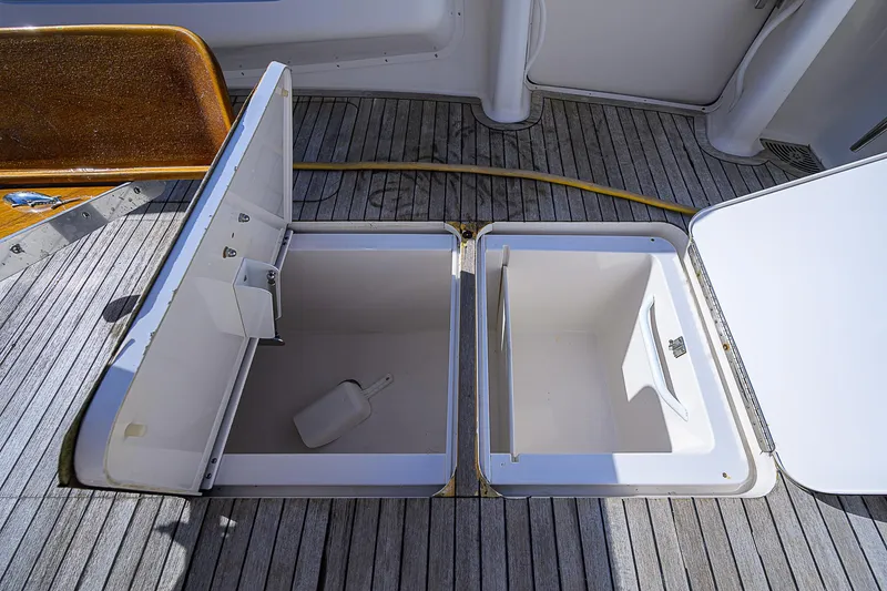 Slide: The Image of Open storage compartments on 2007 Viking 68 Convertible yacht deck. - 34