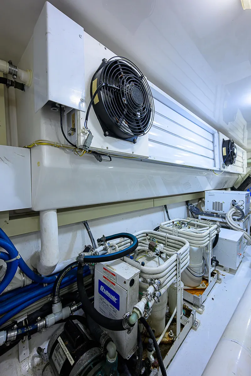 Slide: The Image of Engine room of 2007 Viking 68 Convertible yacht with cooling system and machinery. - 37