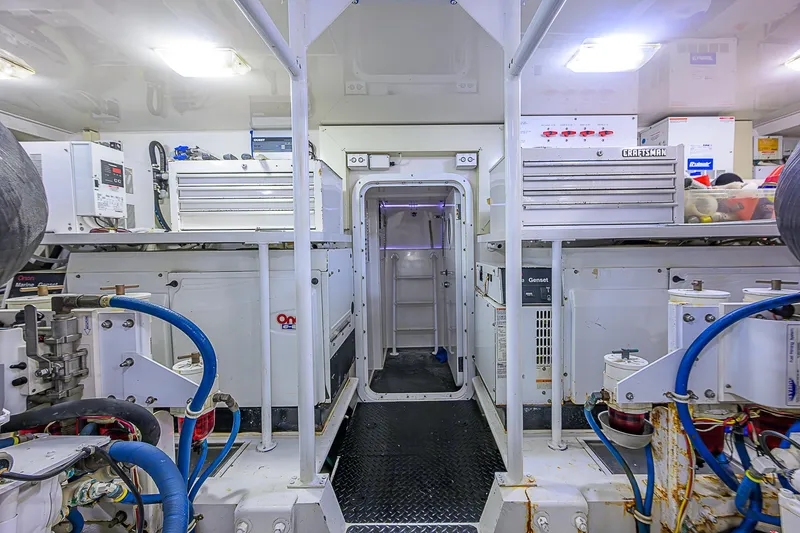 Slide: The Image of Engine room of 2007 Viking 68 Convertible yacht, featuring equipment and storage. - 39