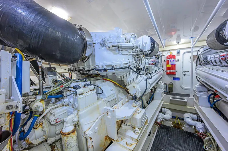 Slide: The Image of Engine room of 2007 Viking 68 Convertible yacht, showcasing powerful machinery and equipment. - 44