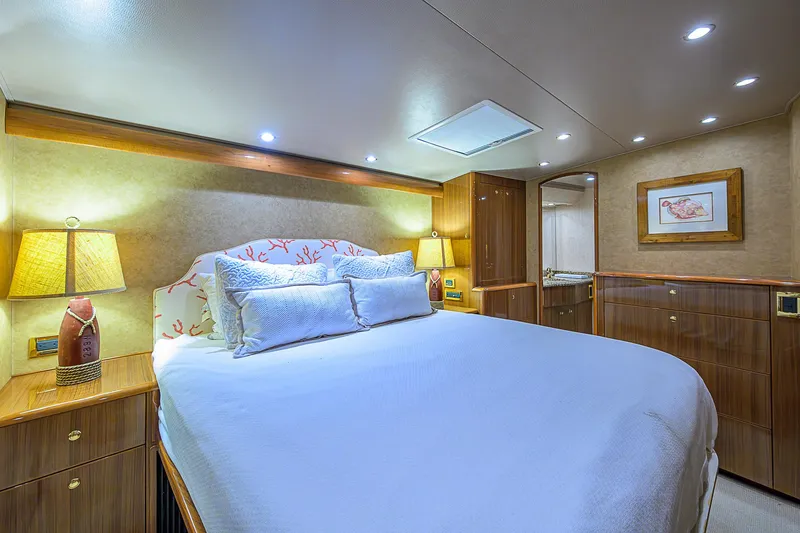 Slide: The Image of Luxurious bedroom interior of 2007 Viking 68 Convertible yacht with elegant lighting and decor. - 9