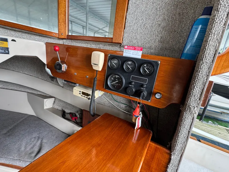 Slide: The Image of Interior dashboard of a 1990 Ranger Tugs R21 Classic boat with gauges and controls. - 24