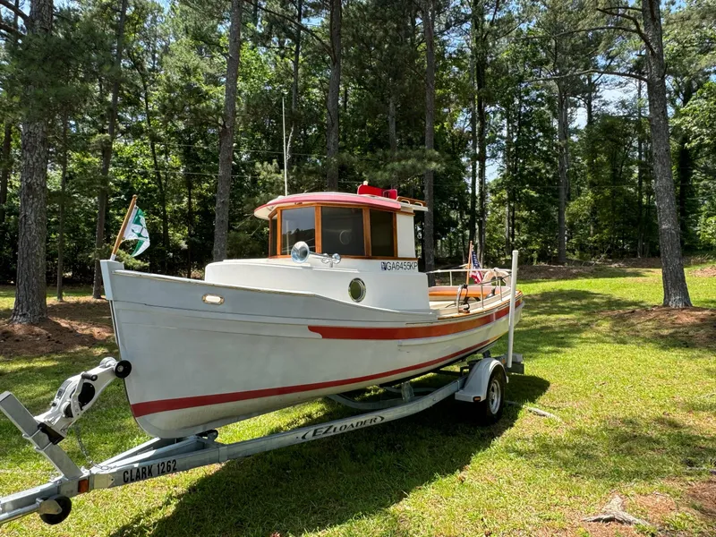 Slide: The Image of 1990 Ranger Tugs R21 Classic boat on trailer in wooded area. - 3