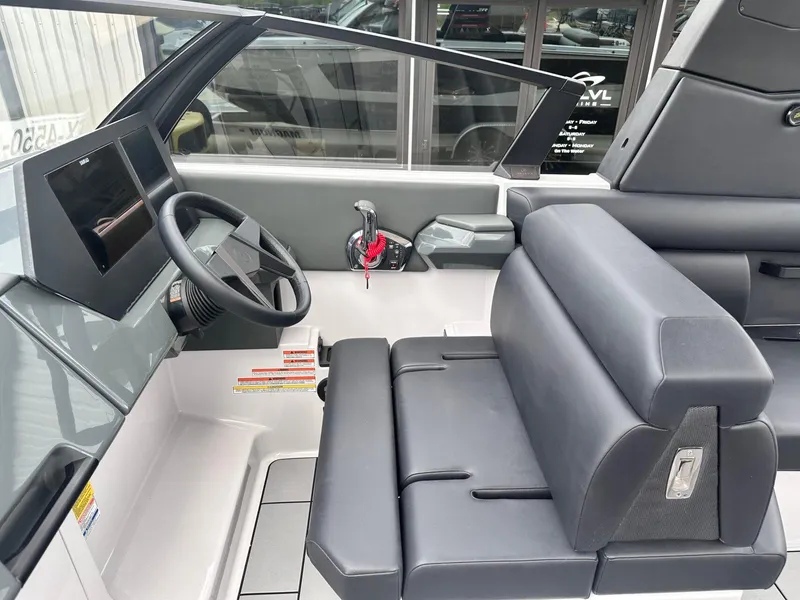Slide: The Image of 2024 Aviara AV28 boat cockpit with modern steering and seating. - 19