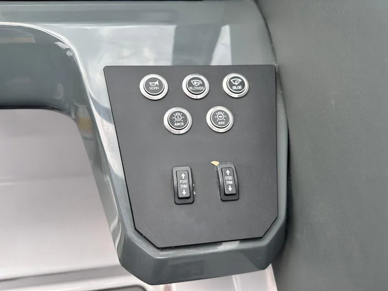 Slide: The Image of Control panel of 2024 Aviara AV28 boat with various function buttons. - 21