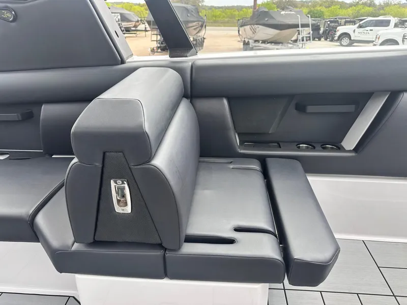 Slide: The Image of 2024 Aviara AV28 boat interior with sleek black seating and modern design elements. - 23