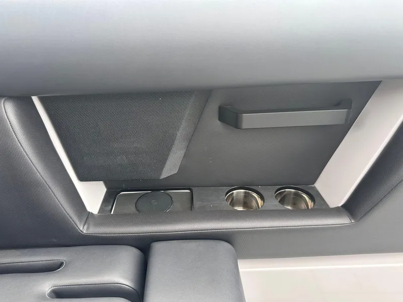 Slide: The Image of 2024 Aviara AV28 interior detail with cup holders and sleek design elements. - 24