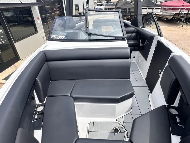 Slide: The Image of 2024 Aviara AV28 boat interior with sleek black seating and modern design. - 26