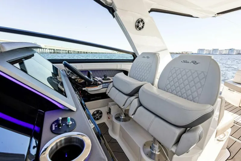 Slide: The Image of 2023 Sea Ray SLX 400 OB cockpit with luxurious seating and modern controls. - 17