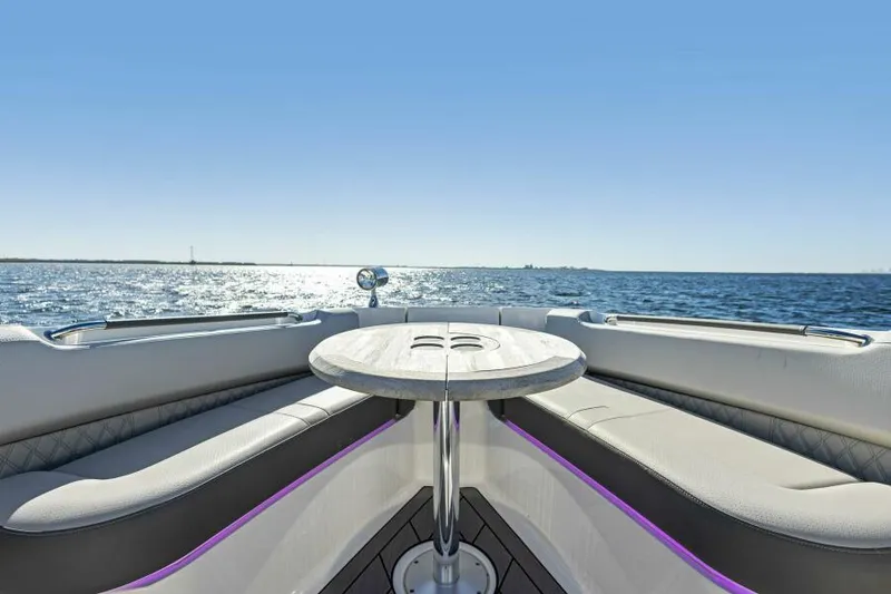 Slide: The Image of 2023 Sea Ray SLX 400 OB boat interior with ocean view and seating area. - 21