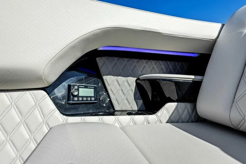 Slide: The Image of Luxurious interior of 2023 Sea Ray SLX 400 OB with quilted seating and modern controls. - 26