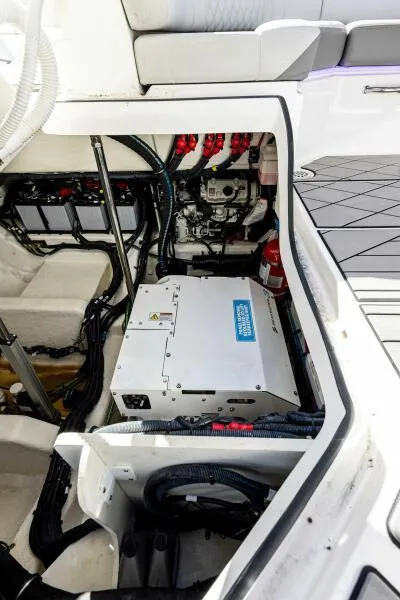 Slide: The Image of 2023 Sea Ray SLX 400 OB engine compartment with advanced electrical systems. - 28