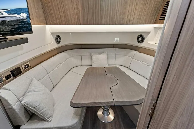Slide: The Image of Luxurious interior of 2023 Sea Ray SLX 400 OB with plush seating and modern design. - 30