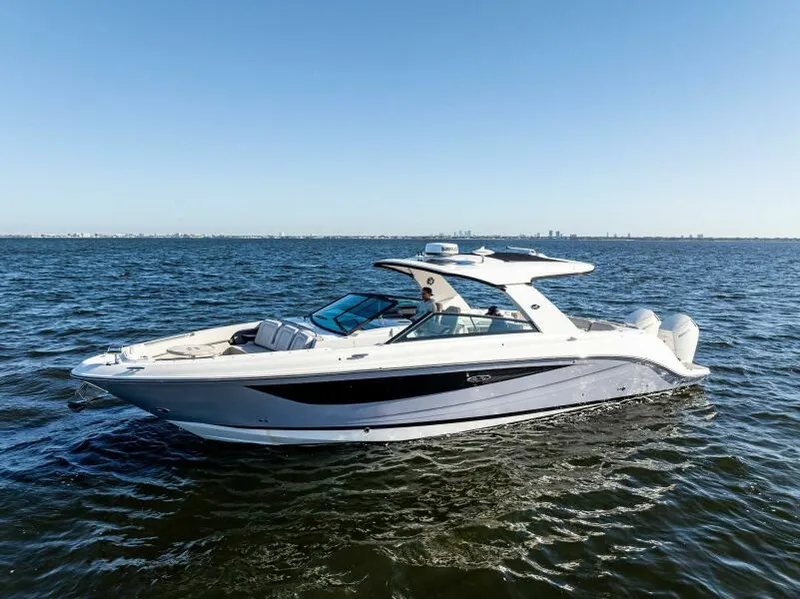 Slide: The Image of 2023 Sea Ray SLX 400 OB luxury boat cruising on open water. - 41