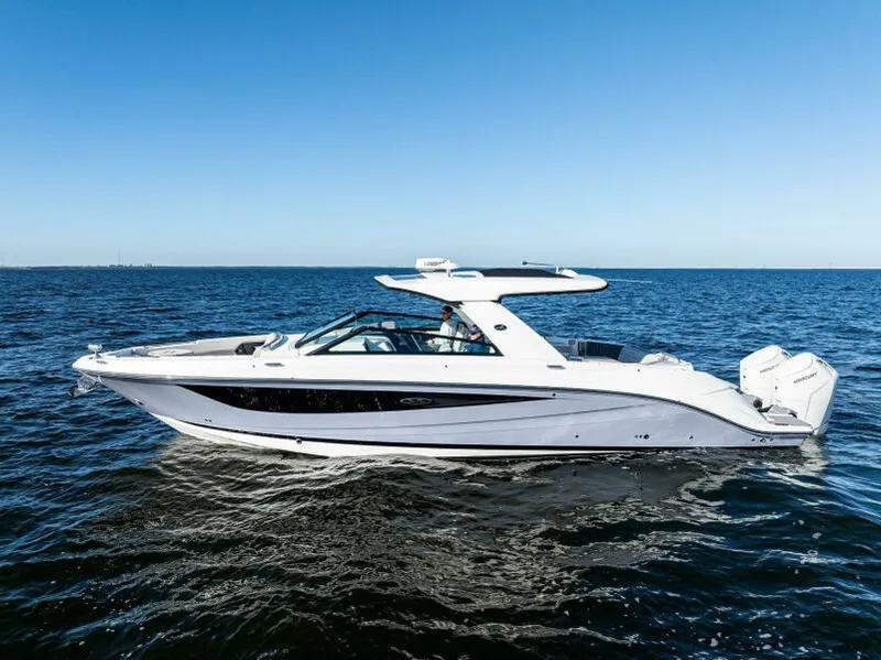 Slide: The Image of 2023 Sea Ray SLX 400 OB luxury boat cruising on open water. - 44