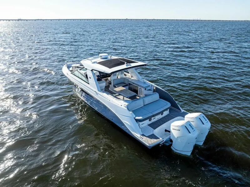 Slide: The Image of 2023 Sea Ray SLX 400 OB cruising on open water. - 48