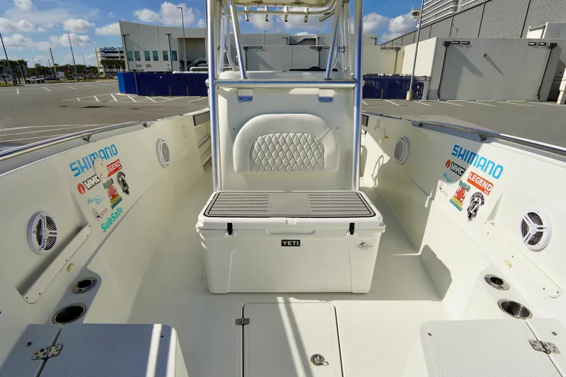 Slide: The Image of 2009 Sailfish 2860 CC boat interior with Yeti cooler and fishing gear. - 15